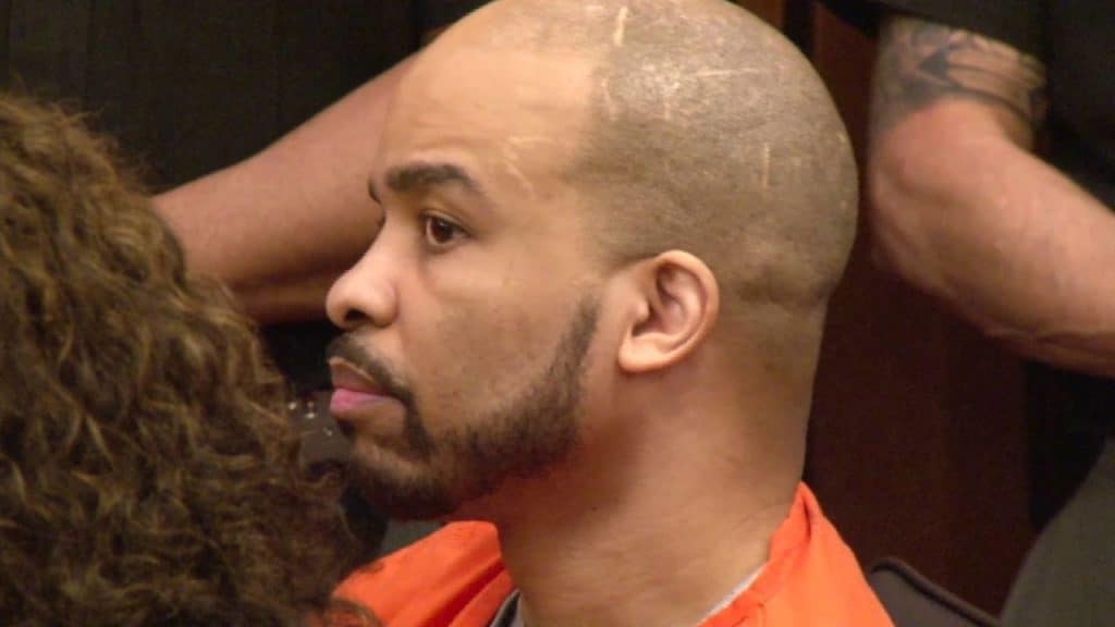 Michael Madison wears his orange prison attire during his trial
